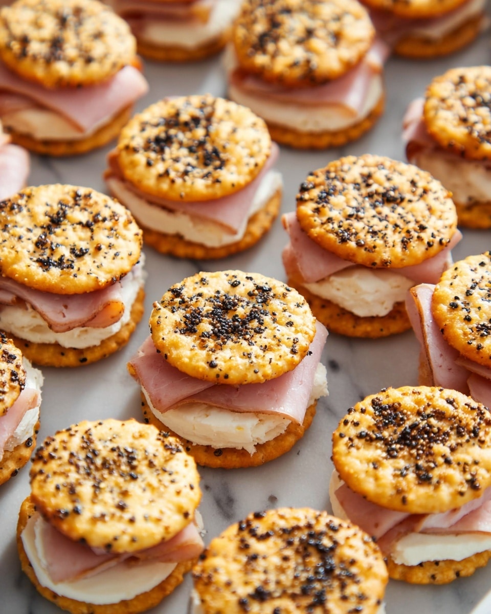 The image shows many small sandwiches with two round, golden brown crackers as the top and bottom layers, each sprinkled with black pepper bits. Between the crackers are two layers: a slice of pink ham and a white creamy spread. The sandwiches are closely arranged, showing a warm toasted texture on the crackers with a slightly crumbly look, all placed on a white marbled surface. Photo taken with an iphone --ar 4:5 --v 7