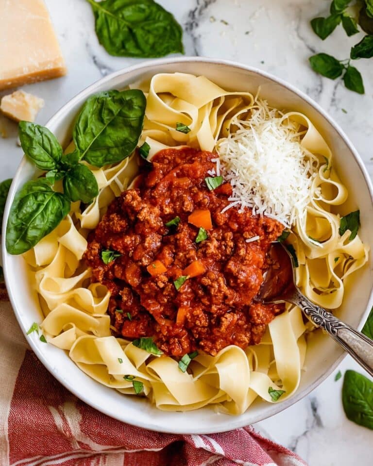Hearty Classic Bolognese Sauce with Fresh Herbs and Cream Recipe