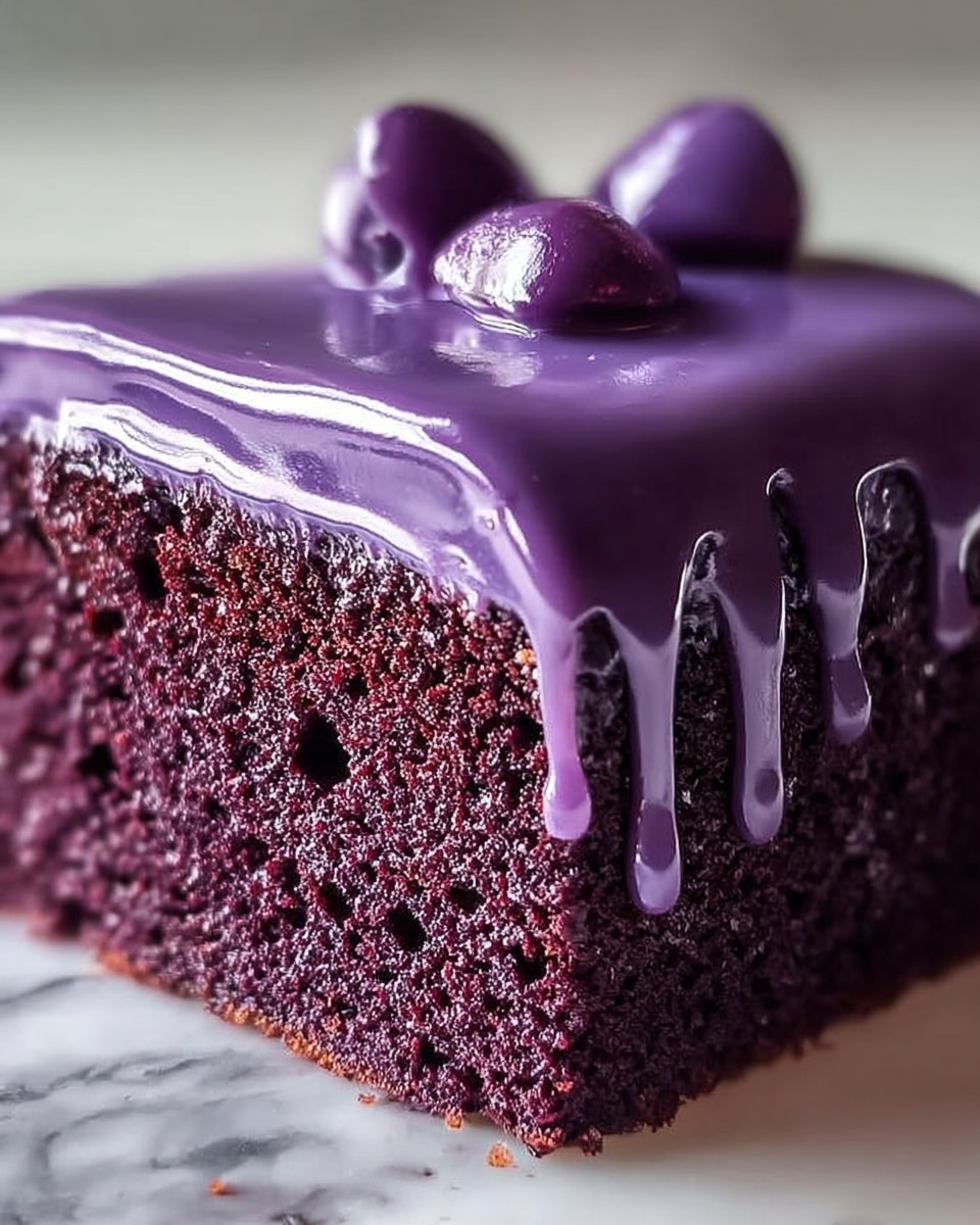 A close-up view of a single piece of purple cake with one thick layer of smooth, glossy purple icing dripping slightly down the sides, revealing the moist, crumbly texture of the deep purple sponge beneath. The icing has a few tiny air bubbles and a shiny surface with a small dollop on top. The cake sits on a white plate against a white marbled textured background. Photo taken with an iphone --ar 4:5 --v 7