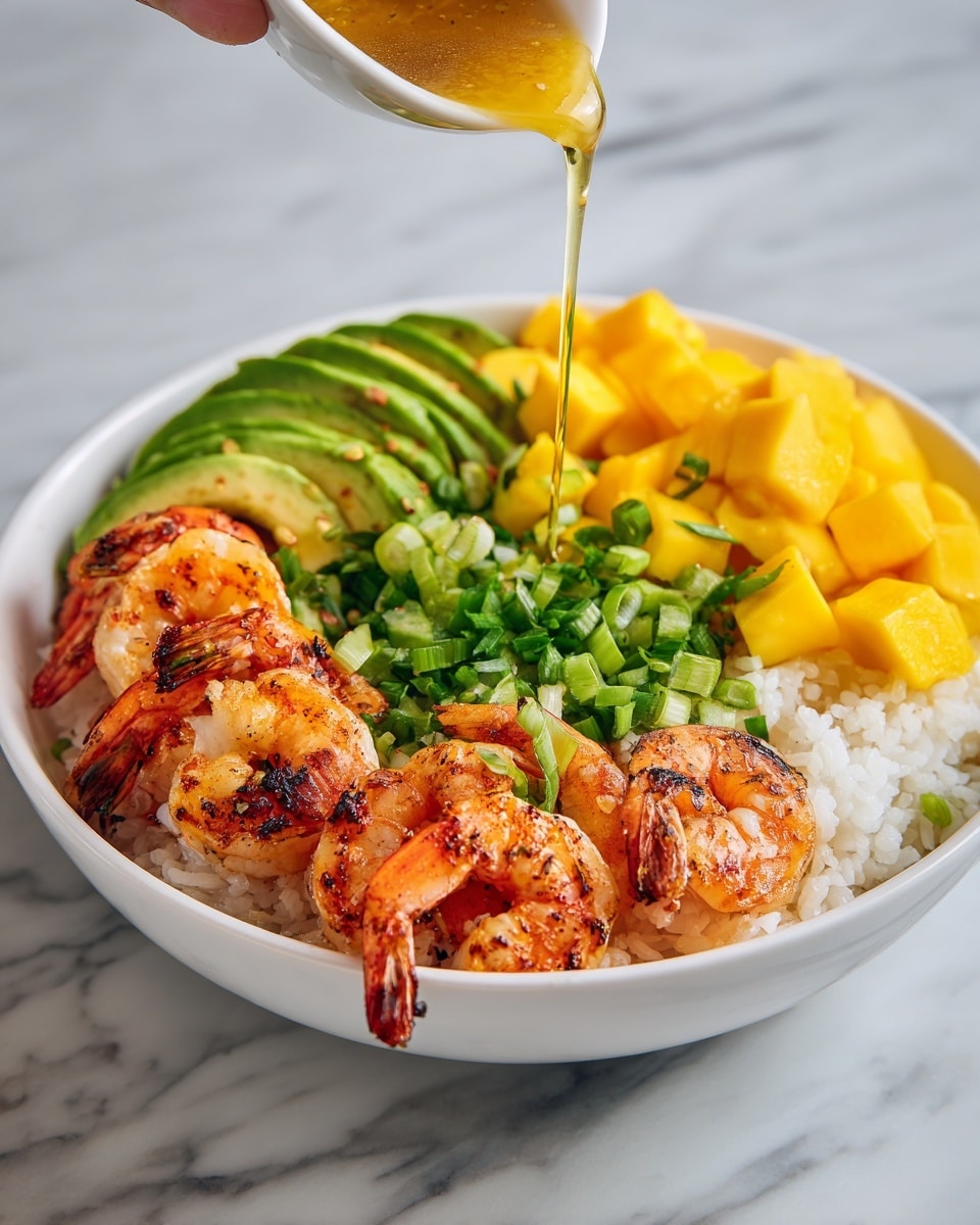 A white bowl filled with a base layer of fluffy white rice topped with grilled shrimp arranged around the edges, showing char marks and a shiny glaze. On one side, there are slices of light green avocado fanned out neatly, and on the other side, a bright yellow mango diced into small cubes. In the center, there is a pile of chopped green onions. A yellow sauce is being poured over the shrimp and rice from above by a woman's hand, adding a glossy finish. The bowl sits on a white marbled surface. Photo taken with an iphone --ar 4:5 --v 7