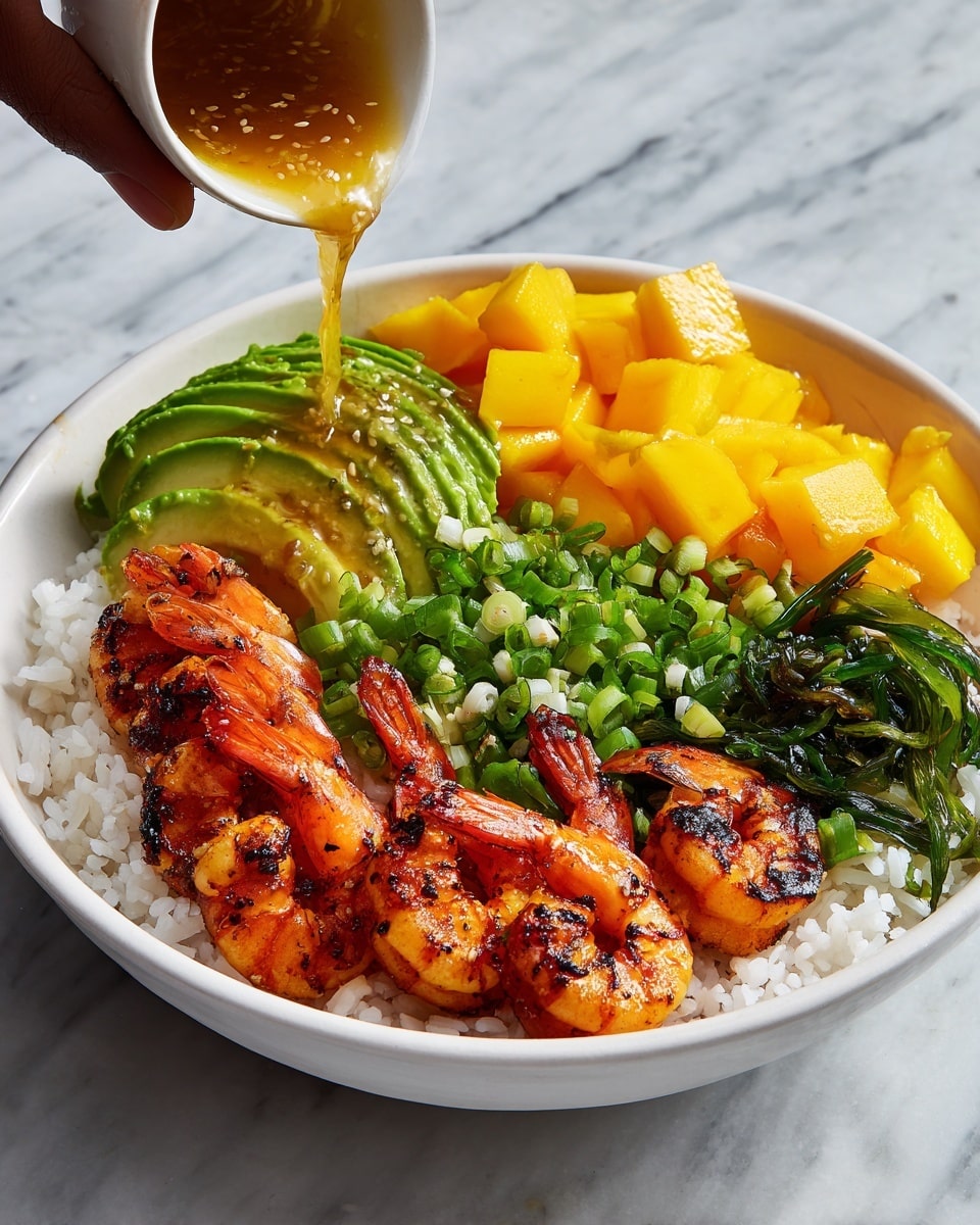 A white bowl filled with several layers of food, starting with a base of white rice. On top of the rice, there are slices of green avocado arranged on one side, bright yellow mango cubes on another side, and fresh green chopped scallions in the center. Grilled shrimp with a slightly charred orange and pink surface are placed on top, curving around the bowl. A woman's hand is pouring a golden sauce over the shrimp and other ingredients. The bowl is set on a white marbled surface. Photo taken with an iphone --ar 4:5 --v 7